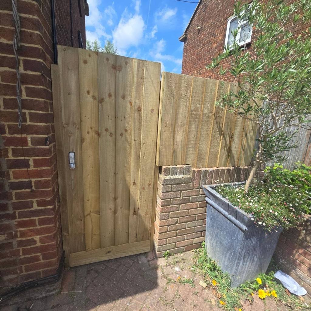 The finished gate and fencing at the front of the property