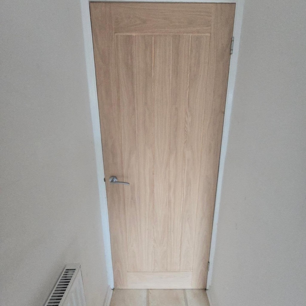 New Holdenby oak internal door fitted to the existing frame