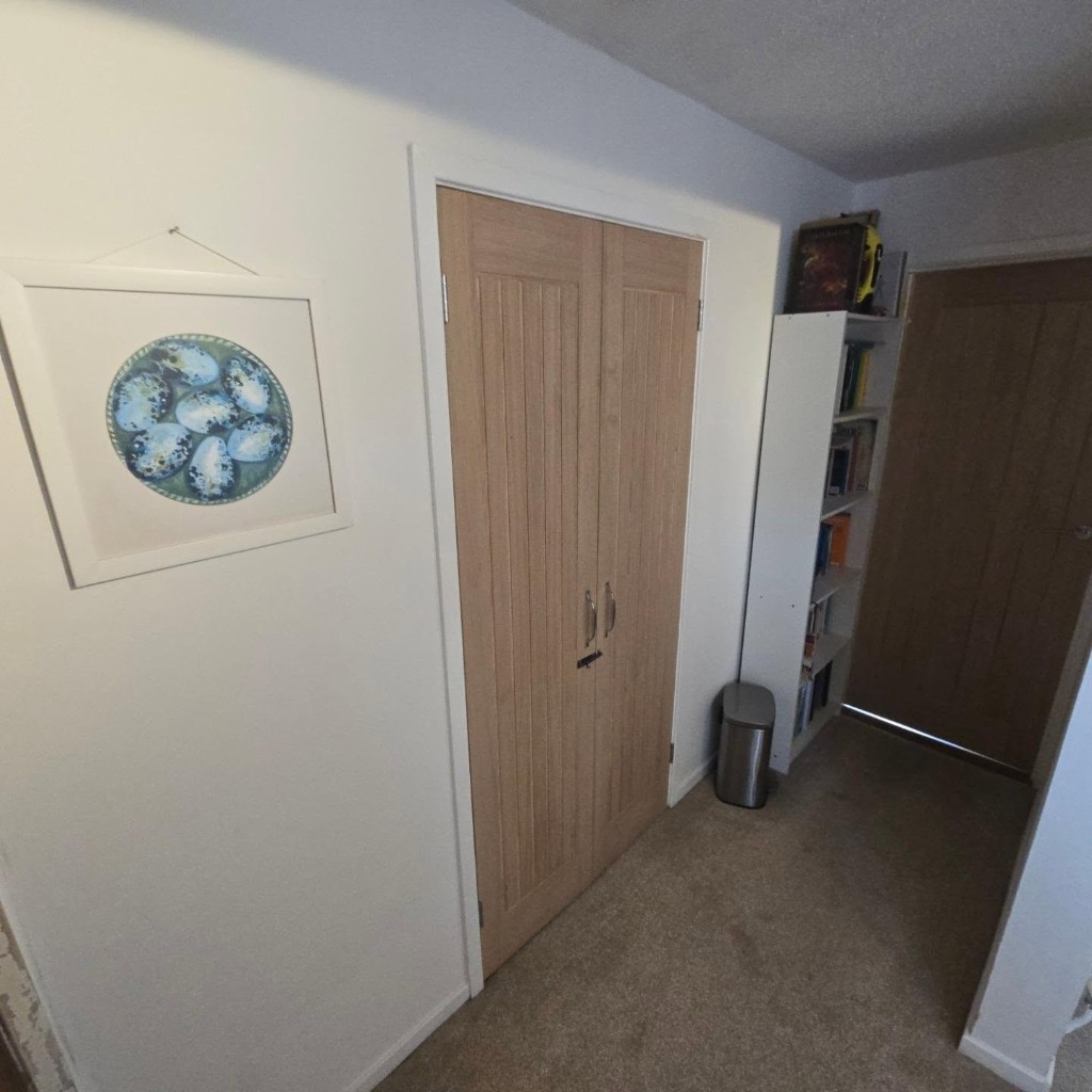 New oak wardrobe doors in place of the old hardboard pair