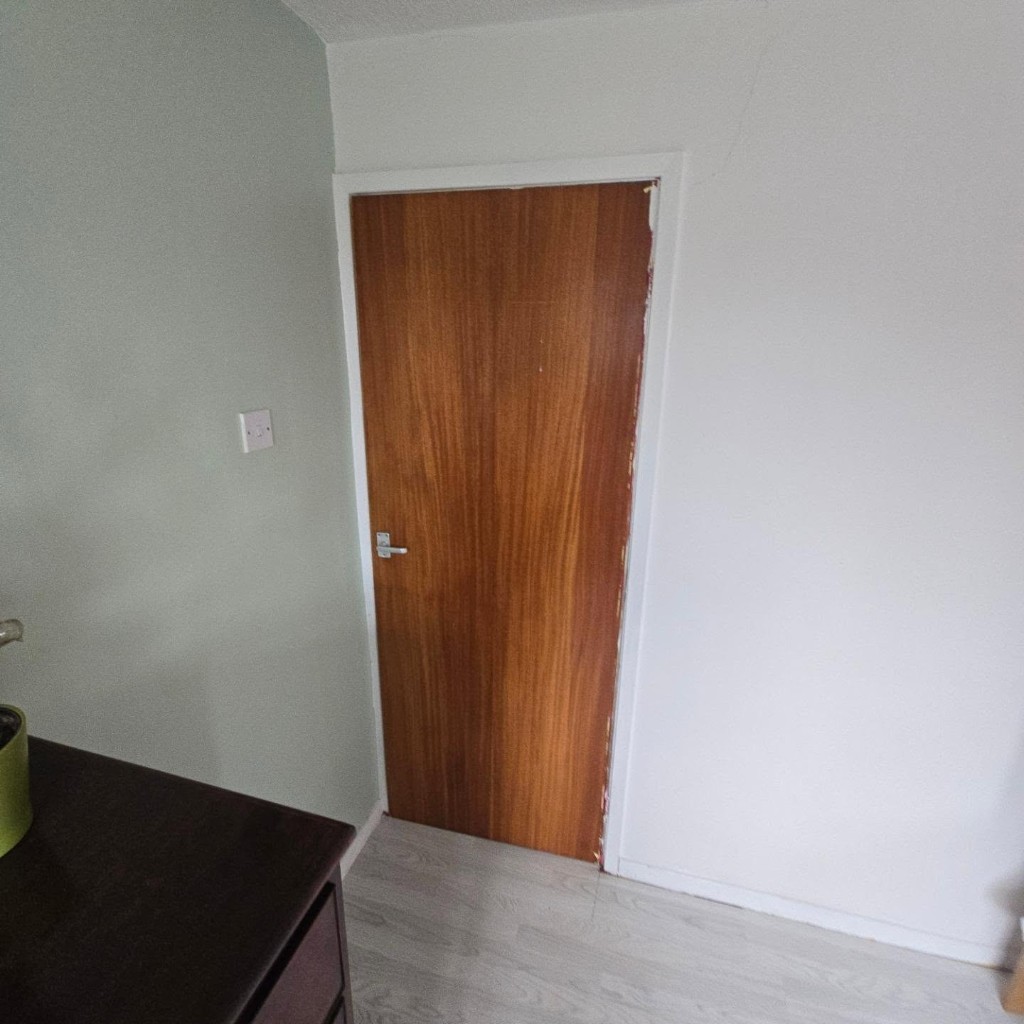 An old internal door with a worn frame