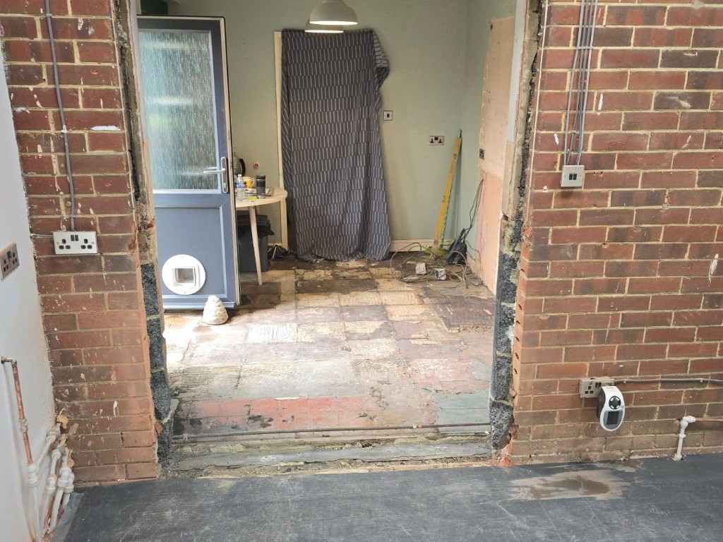 The opening taken through, with the old floor still down