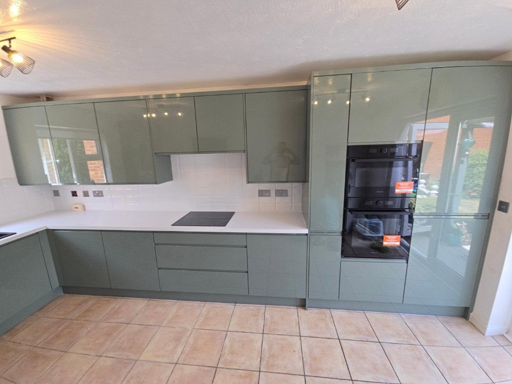 The full run of units, induction hob and built-in ovens